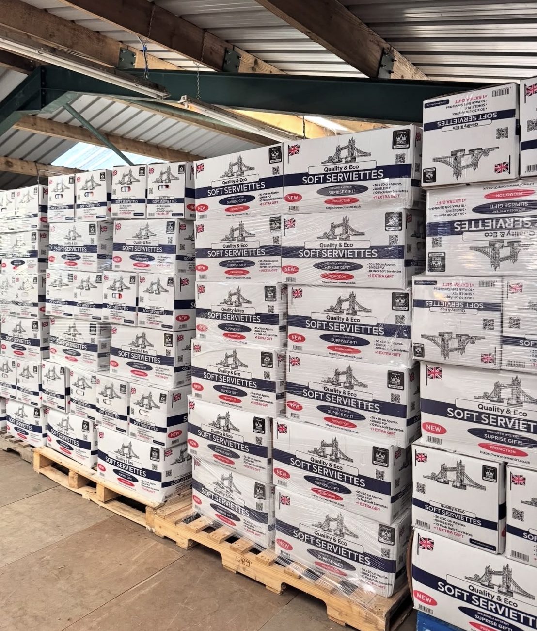 Pallets of Crown01-branded Soft Serviettes stacked in our UK warehouse